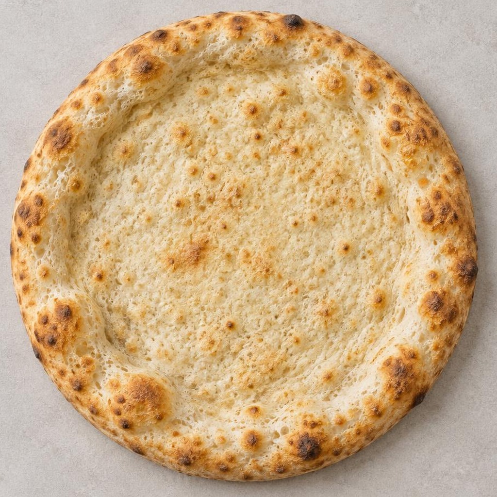 La base pizza precotta al 90%, senza condimenti